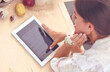© lenets_tan - Young woman using a tablet computer to cook in her kitchen