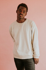 Wall Mural - African American man wearing white sweater mockup on pink background