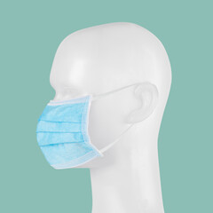 Poster - Blue disposable surgical face mask on a mannequin