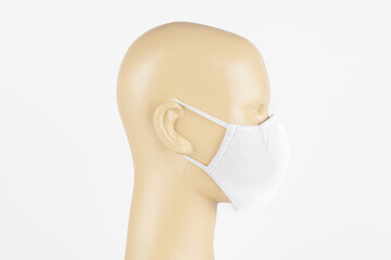 Wall Mural - White fabric face mask on a mannequin