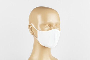 Wall Mural - White fabric face mask on a mannequin