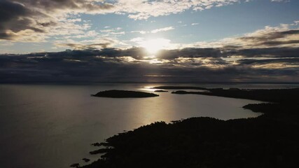 Wall Mural - beautiful panning up sunrise aerial above sugarloaf mountain looking towards presque isle peninsula 