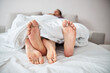 © Svitlana - Young couple in love resting in bed with intertwined legs