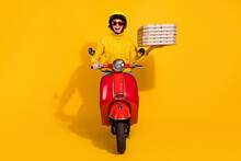 Photo Portrait Of Cheerful Screaming Girl Holding Pizza Boxes In One Hand Riding Red Retro Motorcycle Isolated On Vivid Yellow Colored Background