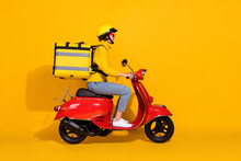 Photo Portrait Profile Of Woman With Big Package On Back Riding Red Retro Scooter Isolated On Vivid Yellow Colored Background