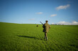 Scenic view of hunter waiting for a prey. Gamekeeper walks over field..