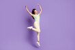 © deagreez - Full length body size view of her she nice-looking attractive lovely slender cheerful cheery girl jumping dancing enjoying rest party isolated bright vivid shine vibrant lilac violet color background