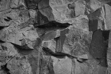 White Stone Background. Rock Texture. Gray Stone Grunge Background. Fragment Of The Mountain Surface. Close-up. It Looks Like A Stone Wall.