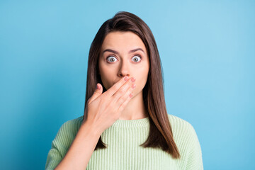 Sticker - Photo of lovely young lady arm close cover mouth afraid face wear green sweater isolated blue color background