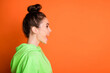 © deagreez - Photo of adorable shiny young woman wear green hoodie standing profile isolated vivid orange color background