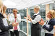© Roman - afro american woman get congratulations by caucasian colleagues, clappng hands for her, celebration