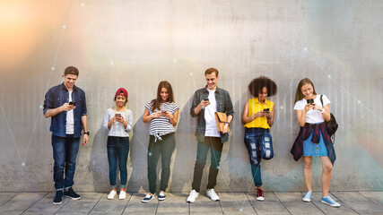 Wall Mural - Diverse people using phones in a city