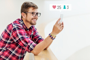 Canvas Print - Happy man using social media on his smartphone