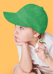 Wall Mural - Girl wearing green cap in studio