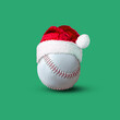 Baseball ball in Santa hat isolated on a green background. Design element.