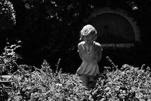 Creepy Child Statue In The Garden