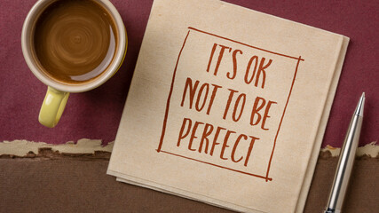 Wall Mural - it is OK not to be perfect - inspirational handwriting on a napkin with a cup of coffee, acceptance, positive mindset, success and personal development concept