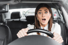  Woman Screaming While Driving Car On Blurred Foreground