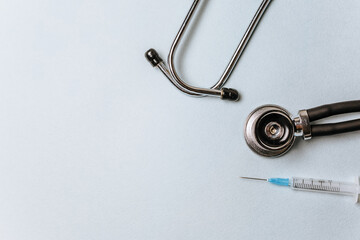 Medical concept flat lay with stethoscope on a blue background