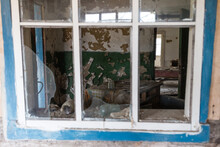 Old Broken Window In Abandoned Village Of Chernobyl Zone