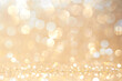© nongnuch_l - Gold, yellow abstract light background, Pink Gold  bokeh shining lights, sparkling glittering Christmas lights.Season greeting background.New year Luxury backdrop image.Blurred abstract background.