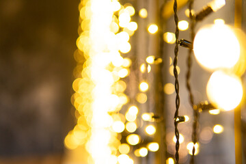 Christmas winter bokeh background. Christmas abstract bokeh lights. Festive holiday background with shallow depth of field and space for text. New Year winter horizontal design.