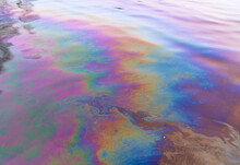 Oil Petrol Water Pollution. Ecological Disaster. Slick Industry Oil Fuel Spilling Water Pollution. Water Surface Patches Of Gasoline And Oil. Ecological Catastrophy. Concept Of Environmental Problems