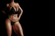 © PixlMakr - Sexy young woman with big boobs in a black bikini in soft light