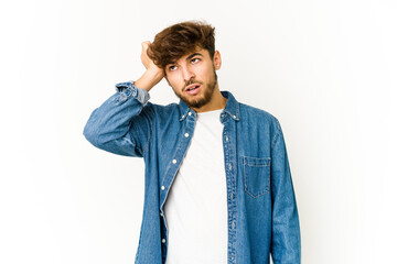 Young arab man on white background being shocked, she has remembered important meeting.