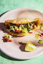 Close Up Of Puffy Taco Served On Plate