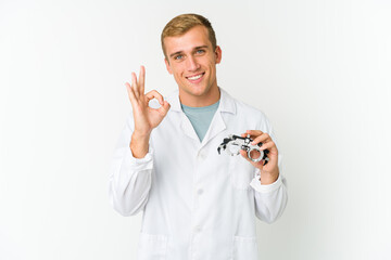 Young caucasian optical man isolated on white background