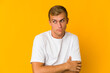 © Asier - Young caucasian handsome man confused, feels doubtful and unsure.