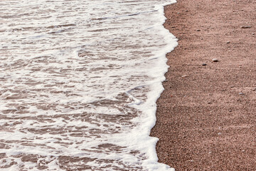 Wall Mural - Wave of the sea water at evening time.