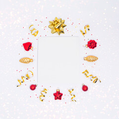 Poster - Christmas postcard with paper blank, red and golden decorations, ribbon, confetti and sparkles on light background. Flay lay, top view, copy space