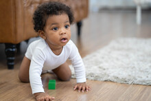Happy African American Little Baby Boy Crawling And Looking For Some Thing To Learn