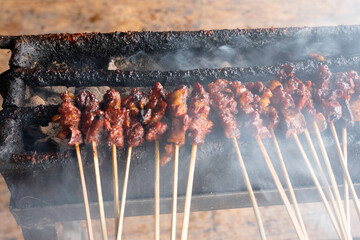 One of the typically Indonesian foods is satay or sate. This food is made from beef or mutton or chicken which is grilled over smoky coals then served with peanut sauce and soy sauce.