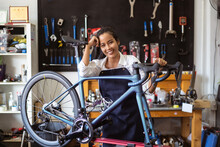 Repair Technician Woman Bicycles Was Repaired Gear Bike Shop.