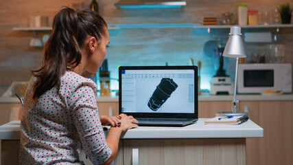 Wall Mural - Designer engineer analizing new prototype of 3D model of the plant working from home. Industrial female worker studying turbine idea on personal computer showing cad software on device display