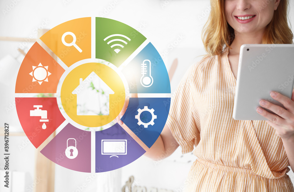 Woman using futuristic interface of smart home automation
