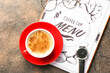 © Pixel-Shot - Cup of hot coffee on table in cafe