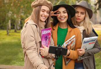 Poster - Beautiful young women taking selfie outdoors