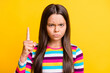 © deagreez - Photo of strict small girl frowning look camera raise direct finger up wear striped shirt isolated yellow color background