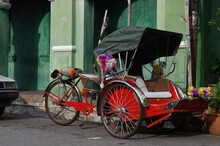 Rickshaw Parked Empty Along The Side Of The Road In George Town, Penang, Malaysia