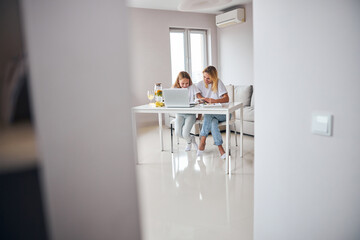 Wall Mural - Lively family members turning over the book pages