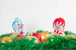 © M.V.schiuma - Snowmen, Christmas balls, green garland. Decoration for Christmas on a white background.Conception, postcard, congratulations