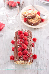 Wall Mural - chocolate christmas yule log cake and raspberry