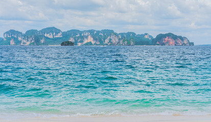 Beach with white sand and soft blue ocean wave