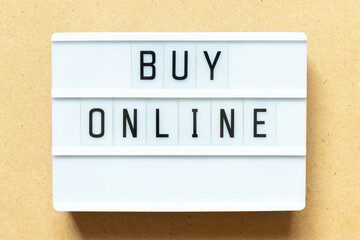 Sticker - Lightbox with word buy online on wood background