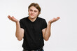 © Drobot Dean - Confused young man doubting shrugging shoulders