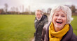 © Monkey Business - Portrait Of Loving Senior Couple Enjoying Autumn Or Winter Walk Through Park Together